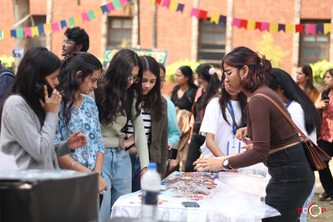 Students gathered at a festival stall