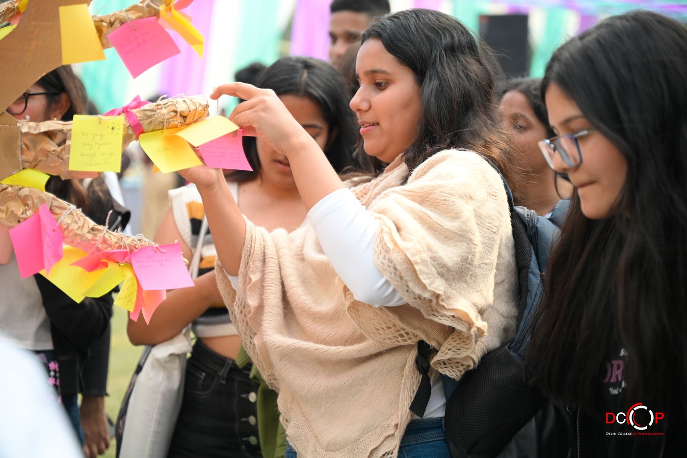 Attendees writing notes